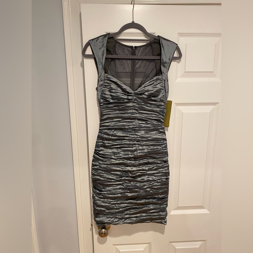 Nicole Miller Size 8 silver dress. Never worn. Tags still on it.